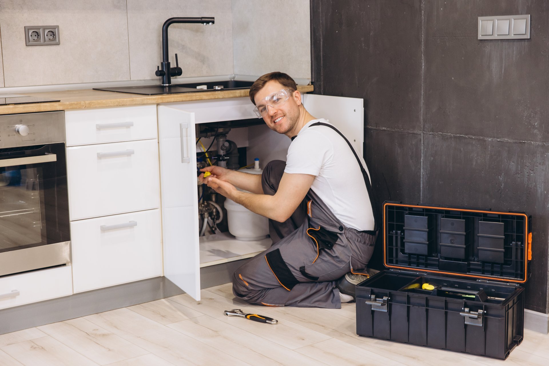 Professional plumber working